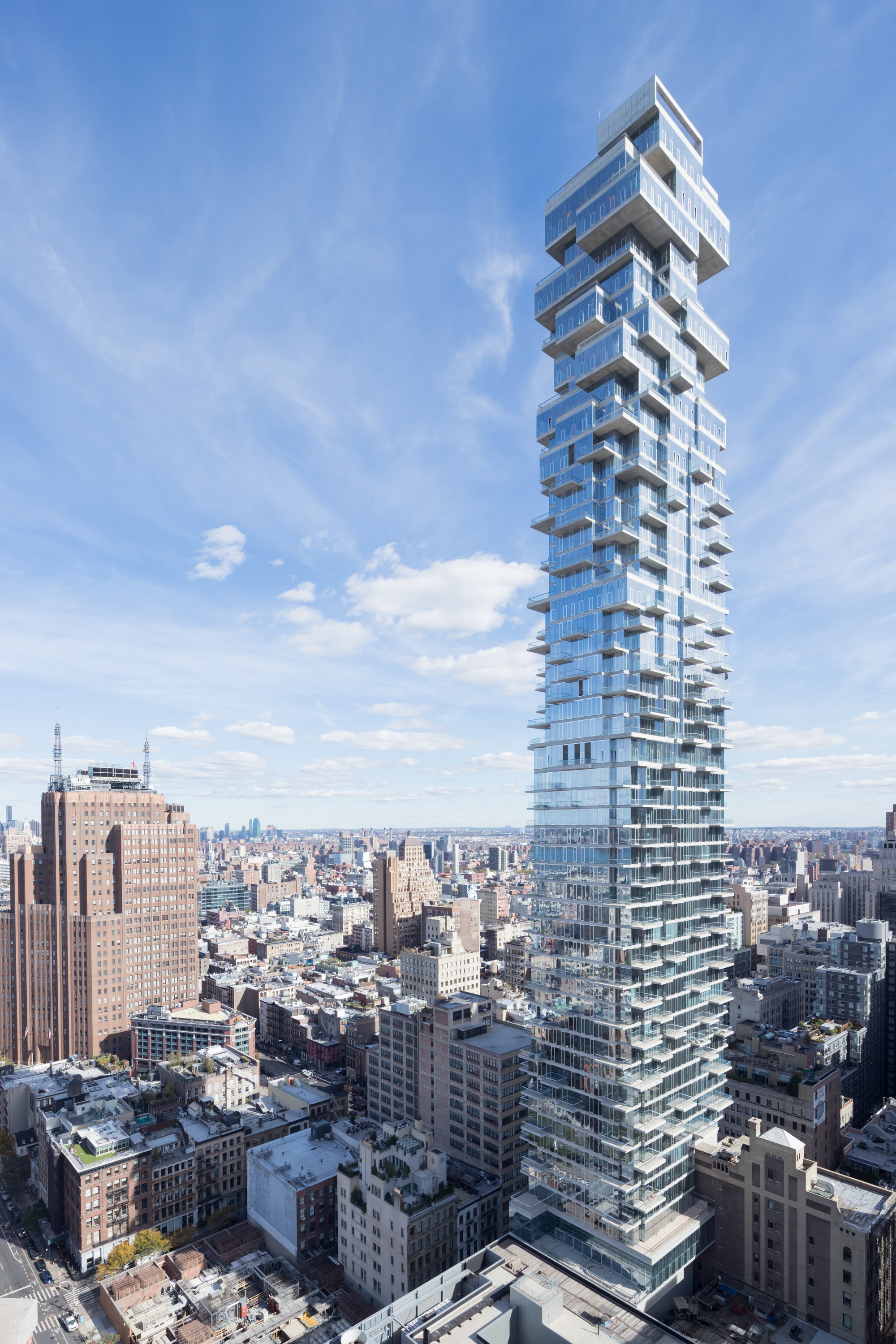Cantilevered facade and terraces against the sky